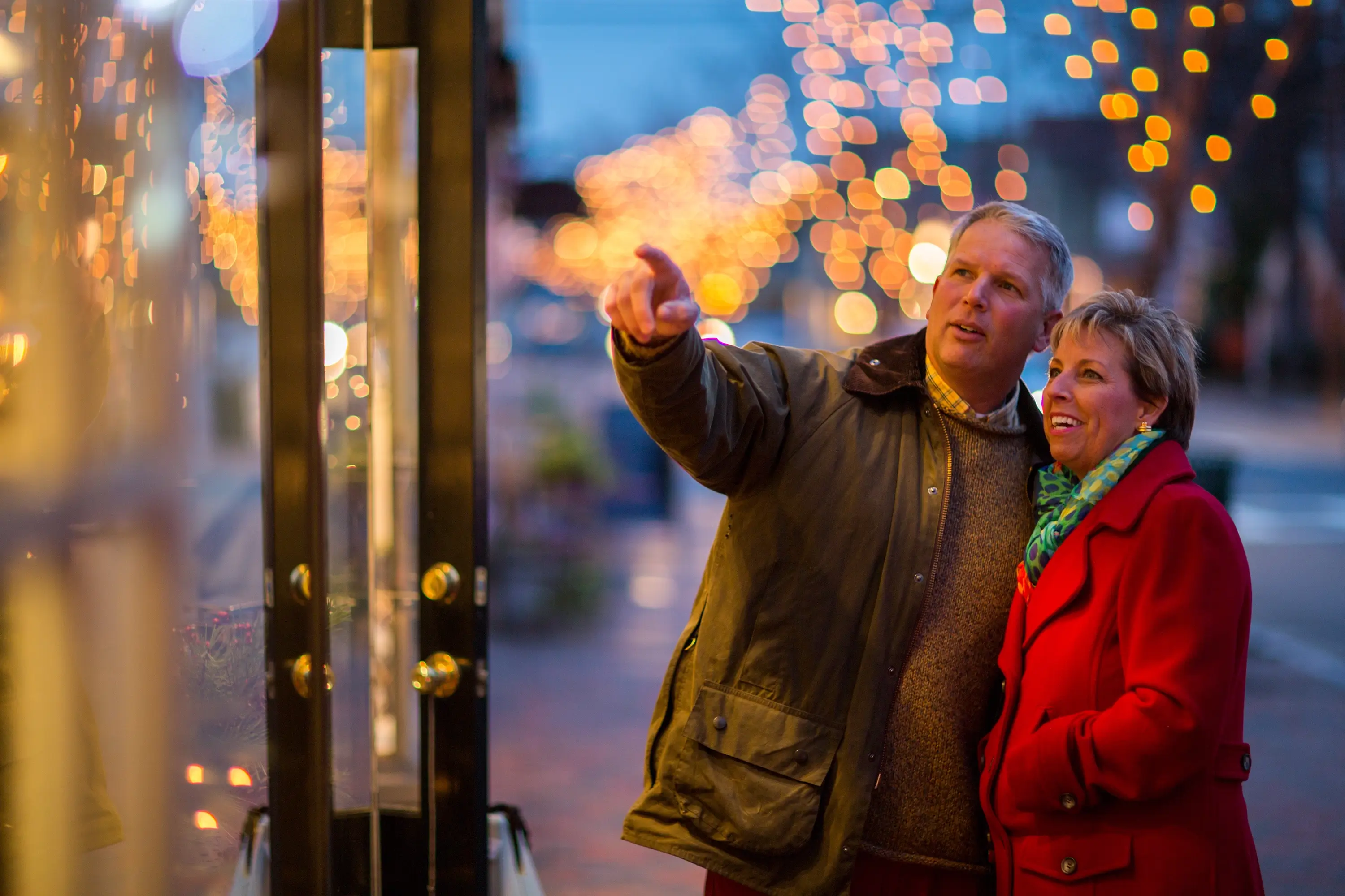 A couple window shopping at Christmas in Talbot County.