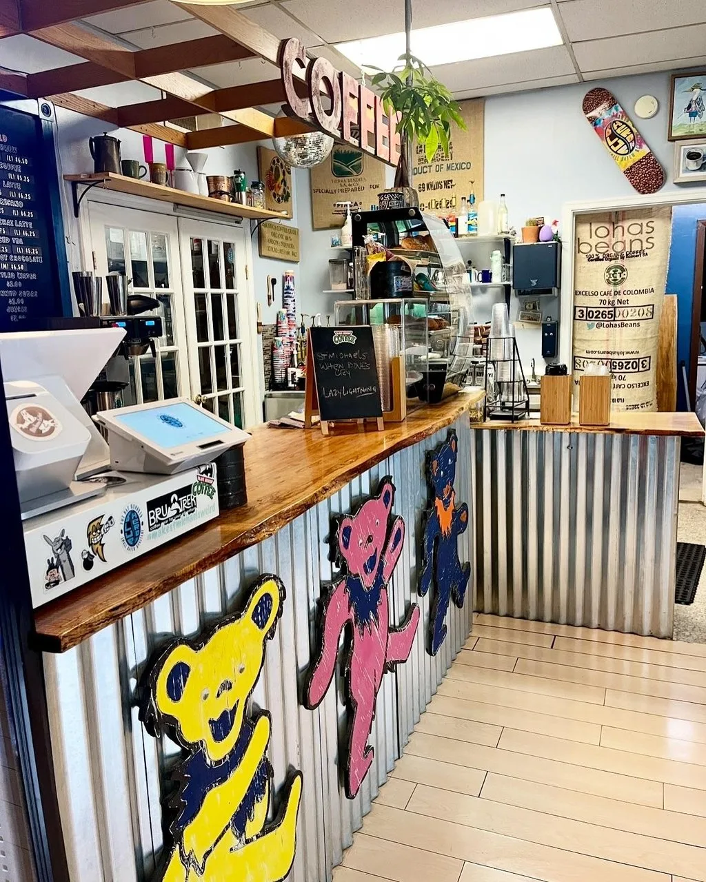 Interior of Blue Heron Coffee featuring an aluminum covered bar with dancing Grateful Dead bears.