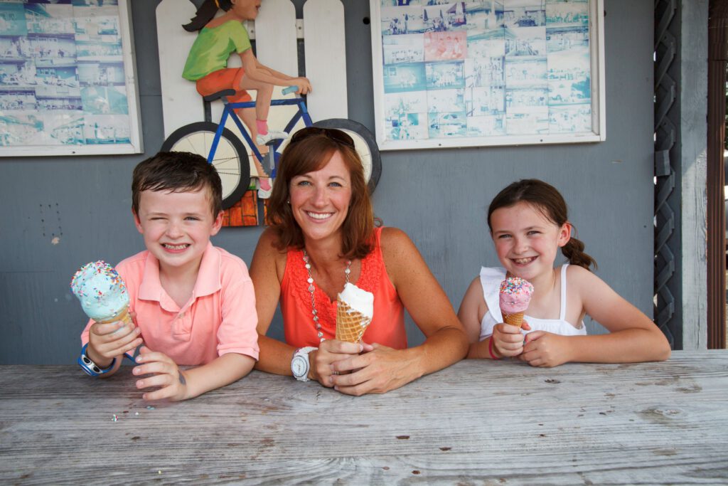 Mother and children with ice cream at the Scottish Highland Creamery in Oxford, Maryland.