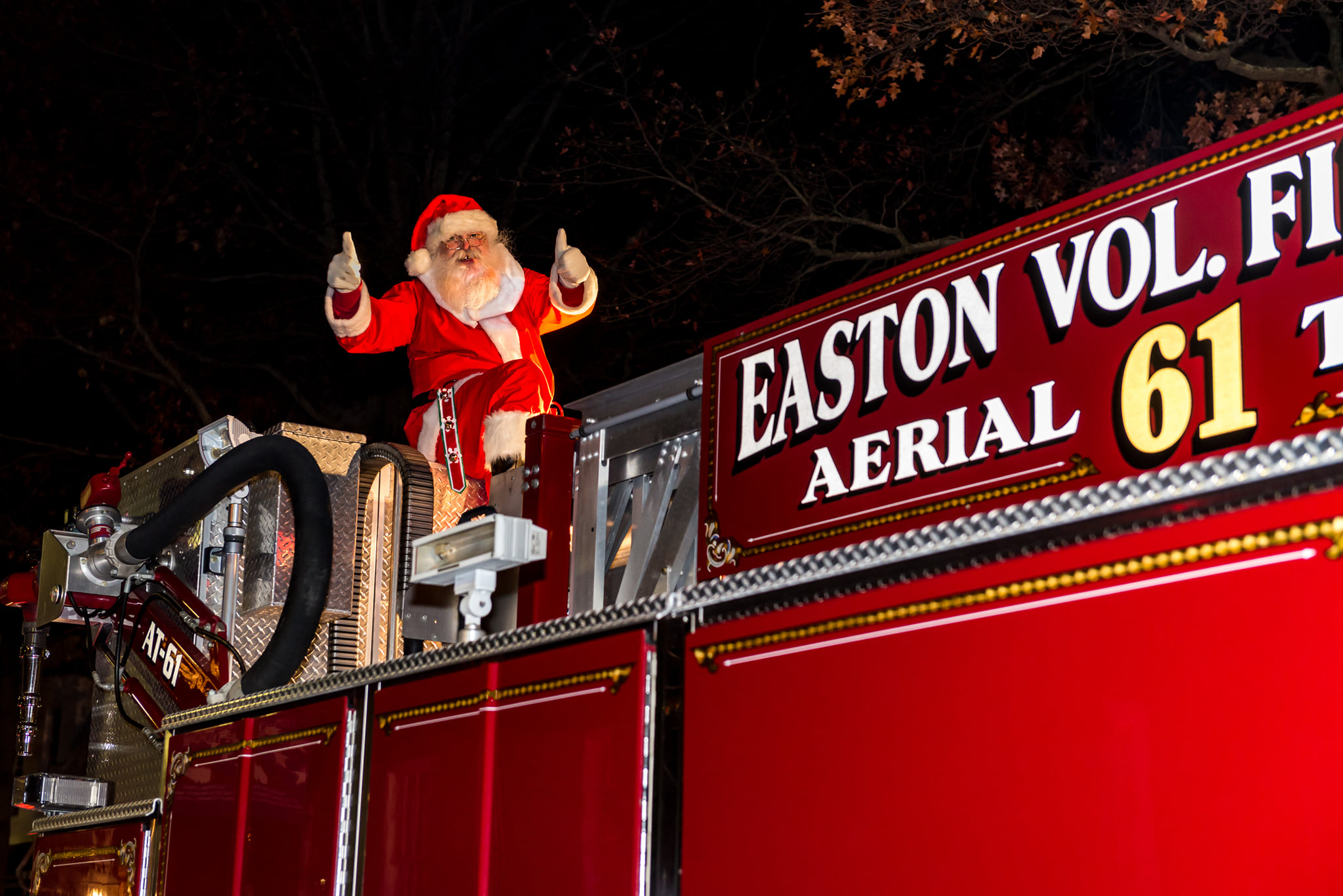 Santa sitting on a firetruck at the Easton Christmas Parade