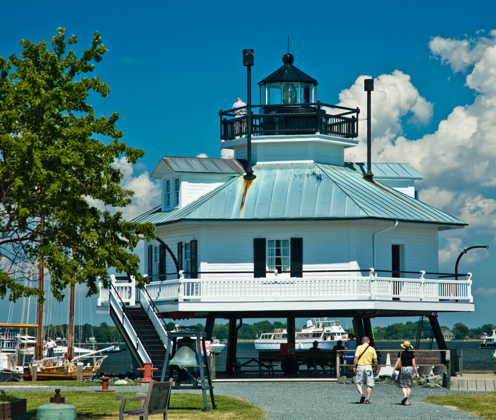 Couples strolls to the Hooper Strait Lighthouse in Talbot County, Maryland.