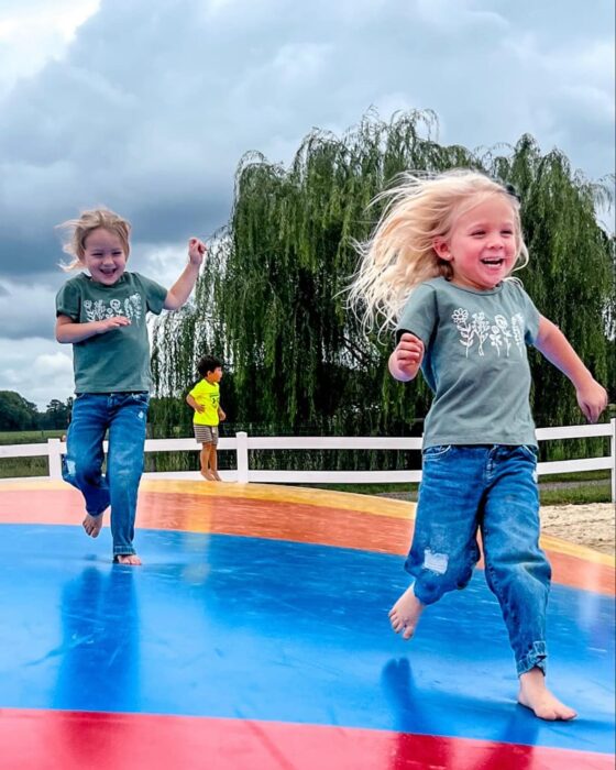 Children jumping on a bounce area at Councell Farms