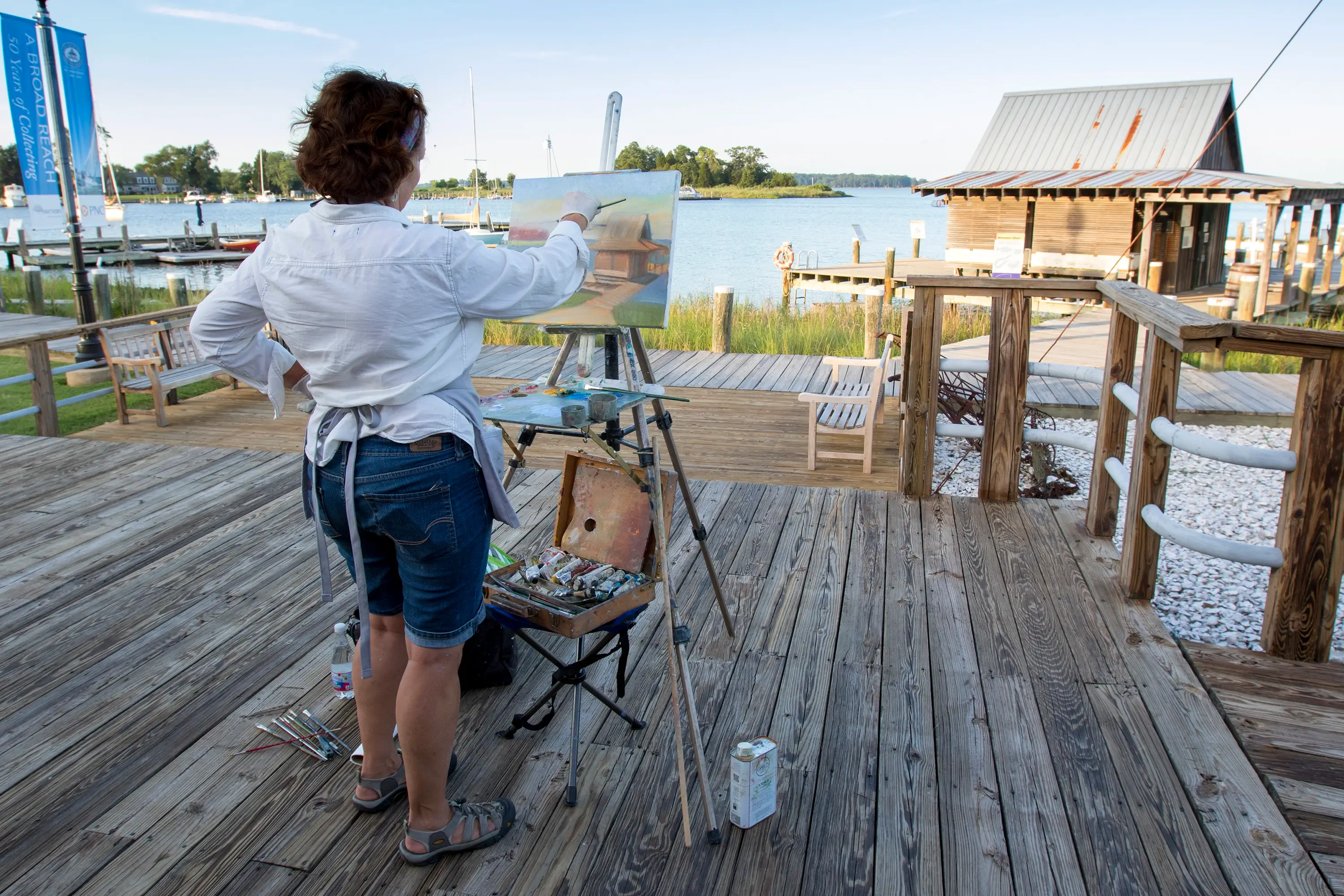 A painter on the dock in Talbot County.