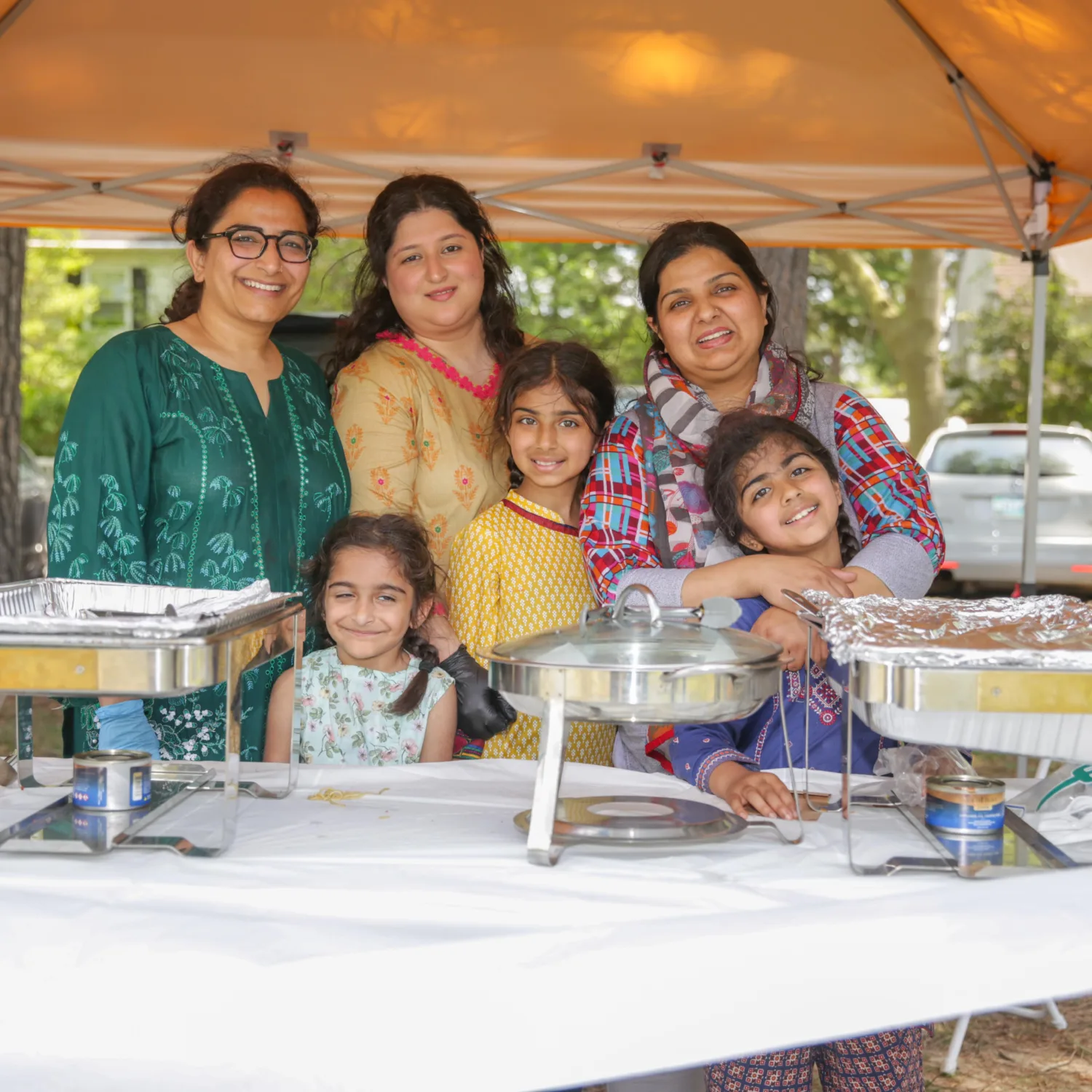 Family of women, serving as a food vendor at the Easton Multicultural Festival